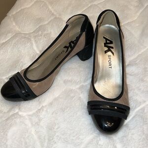 AK Sport two toned patent pumps. Wedge heel. Gently worn. Great shape. Size 8.